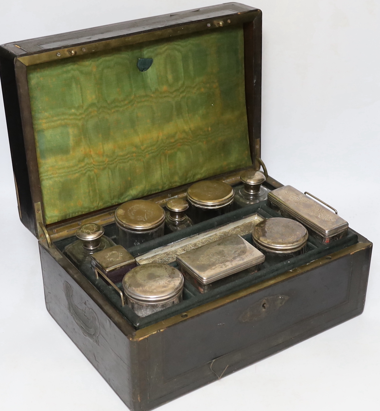 A Victorian vanity case with French white metal lidded jars, 35cm wide